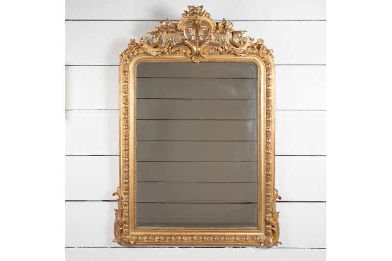 Très beau miroir en bois doré et sculpté de style Régence H. 155 cm - L. 111 cm